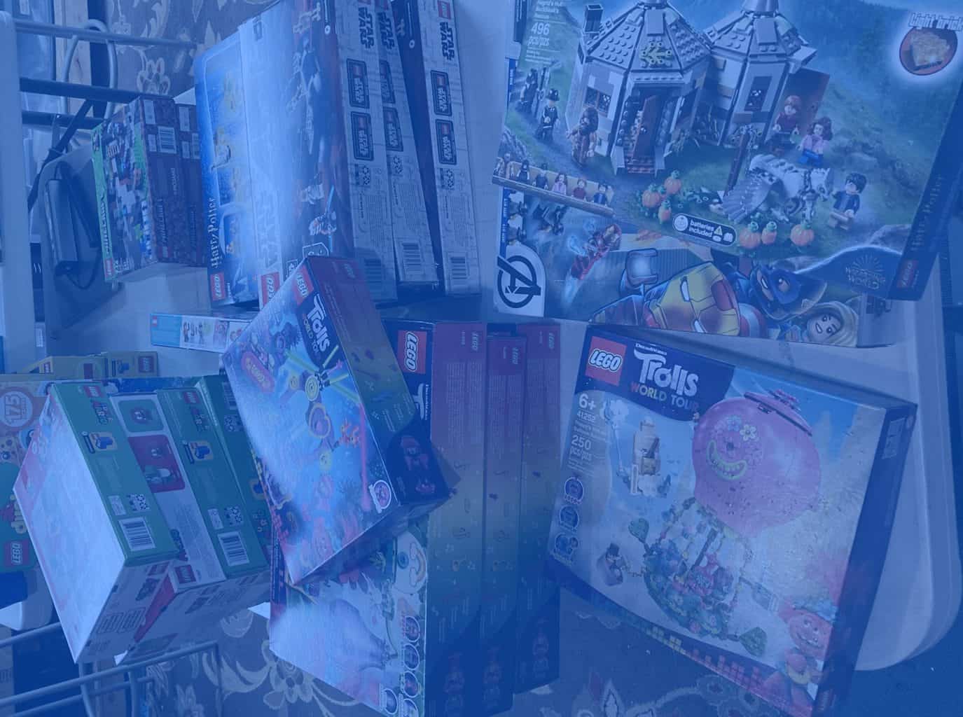 Shelf of boxed LEGO sets