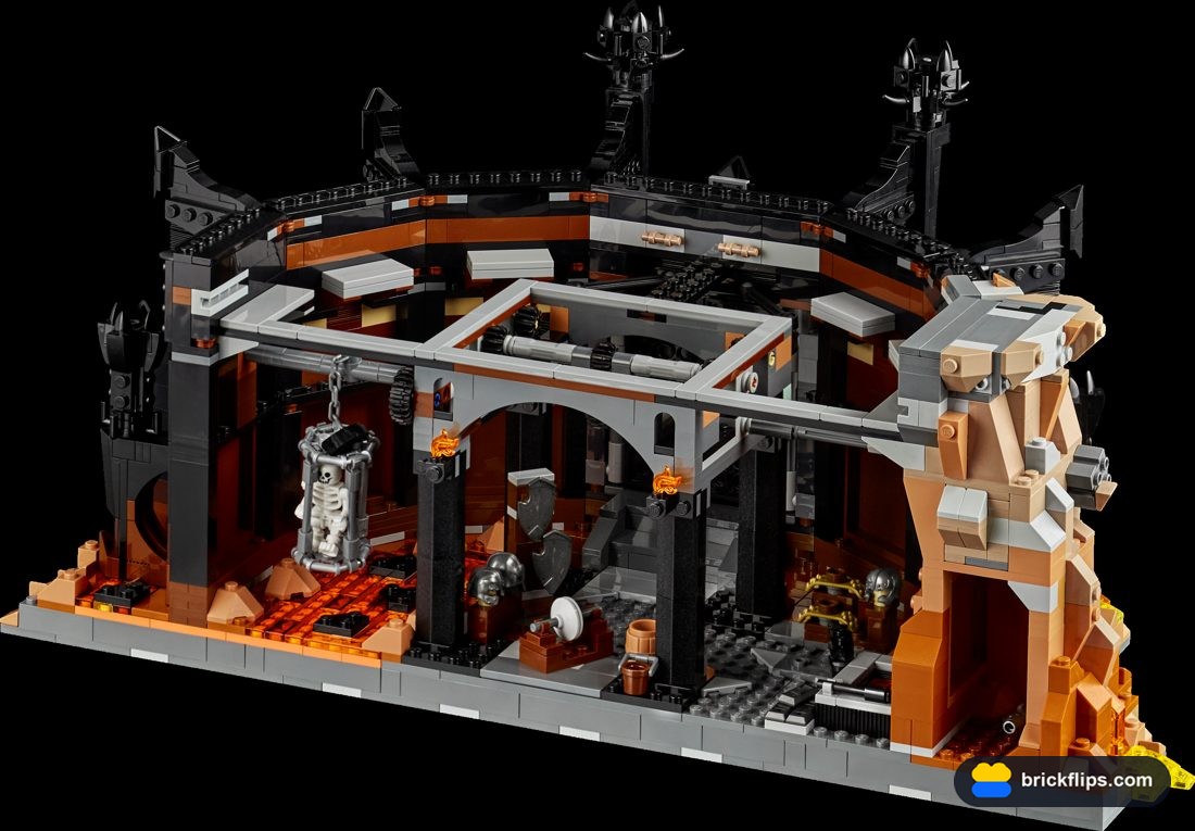 The Orc armory floor inside Barad-dûr, with lava channels, anvils, and a caged skeleton.