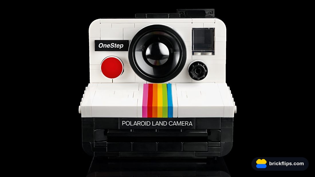 The finished LEGO Polaroid OneStep SX-70, front view with the rainbow stripe and red button.